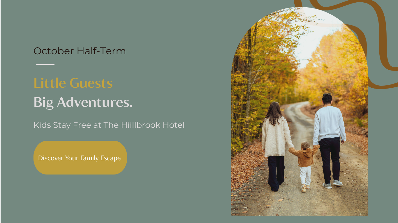 Family of three walking along an autumn woodland path, promoting the Kids Stay Free October half-term offer at The Hillbrook Hotel.